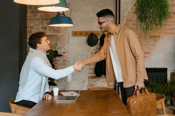 Image of two men shaking hands representing closing of rpa consulting